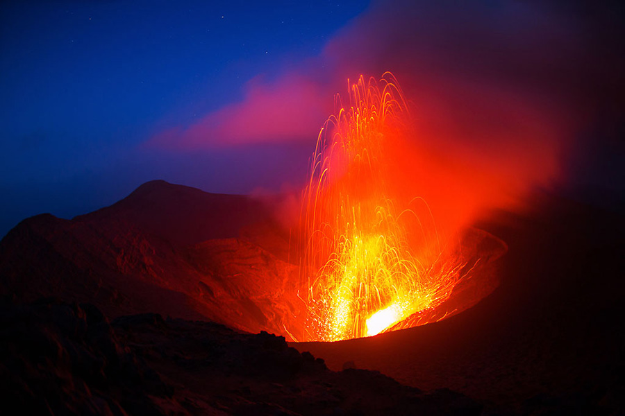 Hike to an active volcano, Mount Yasur. It erupts frequently, and it is quite a show.