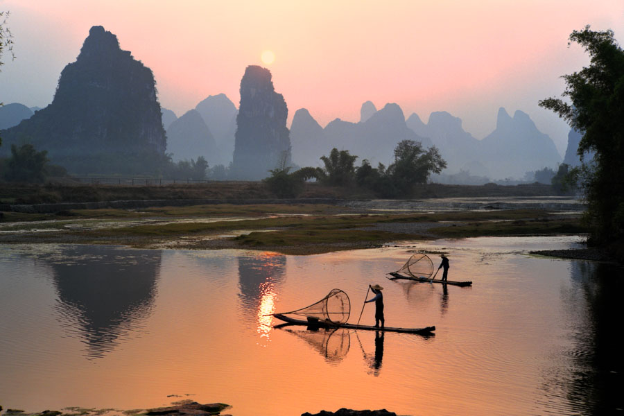 Cruise down the Li River on a bamboo raft and experience the intricate nature of Yangshuo.