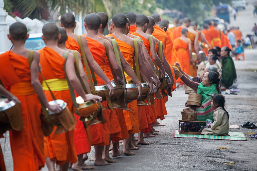 Partake in the moving ceremony of Tak Bat, the giving of alms. Hundreds of Buddhist Monks walk the streets of Luang Prabang to receive sustenance.