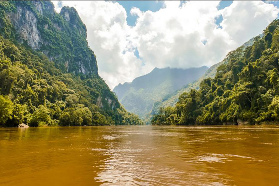 Drive through the jungle into the Golden triangle, then embark on a cruise and sail the Mekong River as you cross into Laos.