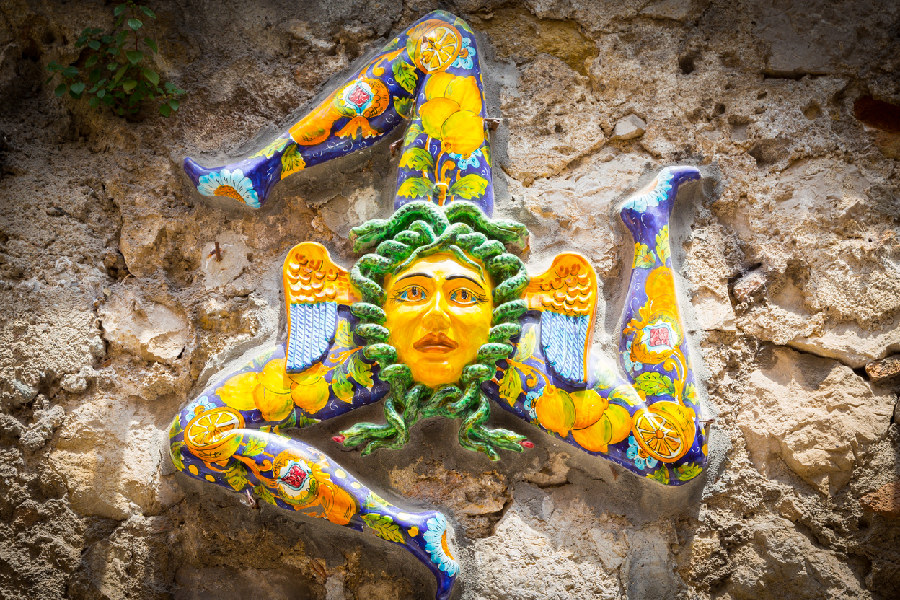 Learn the art of painting Sicilian ceramic from a master artisan in the heart of Taormina.