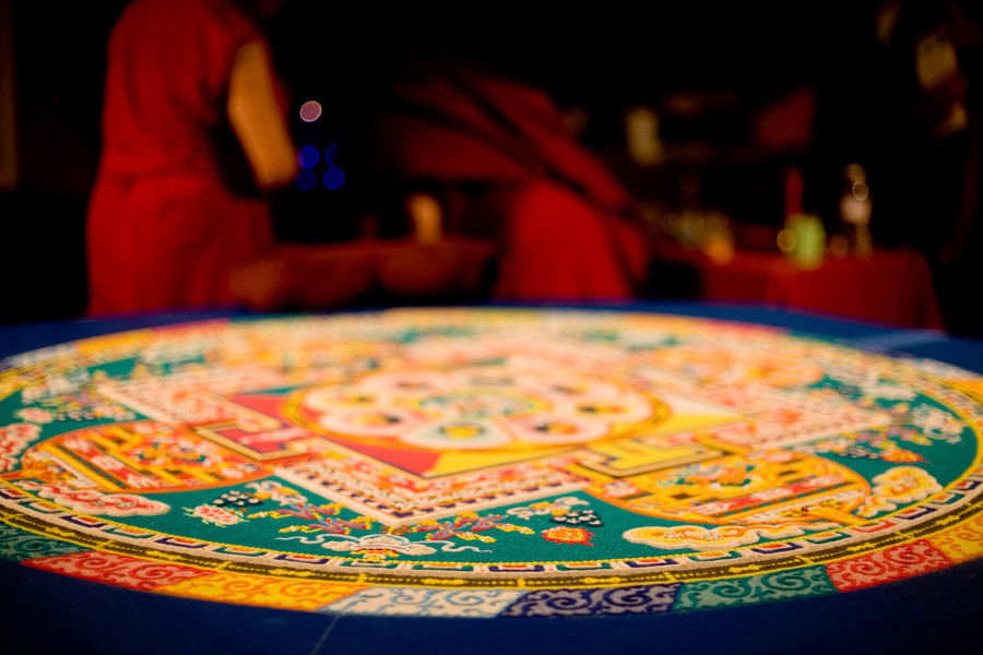 Partake in the creation of a beautiful mandala. Then, at the end of the day, see it destroyed.