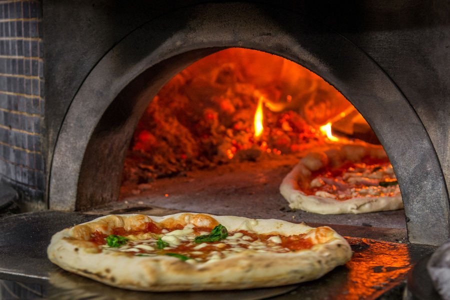 Neapolitan cuisine has conquered the world. It will have to work harder to conquer you, but it will put up a fight.