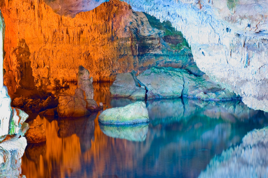 Explore grottoes hidden underneath the characteristic karst cliffs.