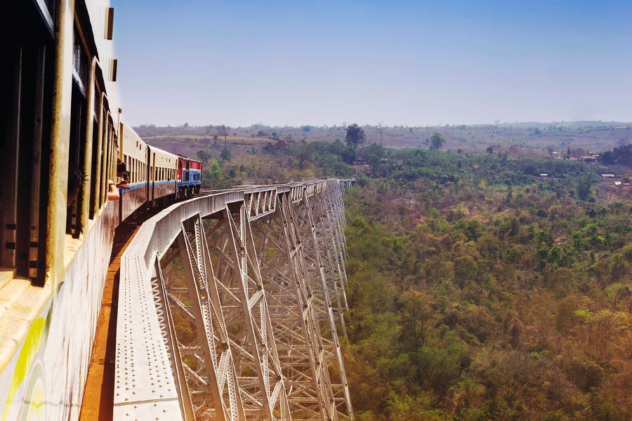 Travel by train through scenic landscapes.