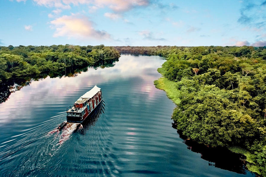 Explore the Peruvian Amazon as your course bends towards its origin, across the sprawling rainforest.