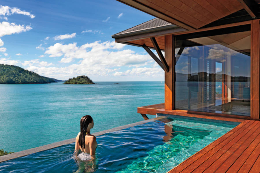 Relax at exclusive resorts nestled in the Great Barrier Reef.